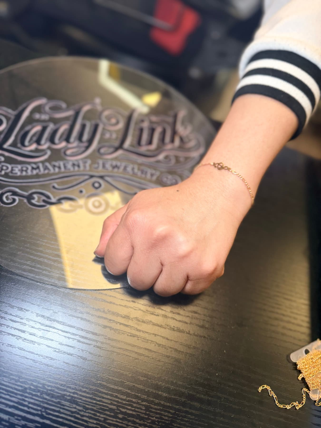 Gold bracelet with a charm